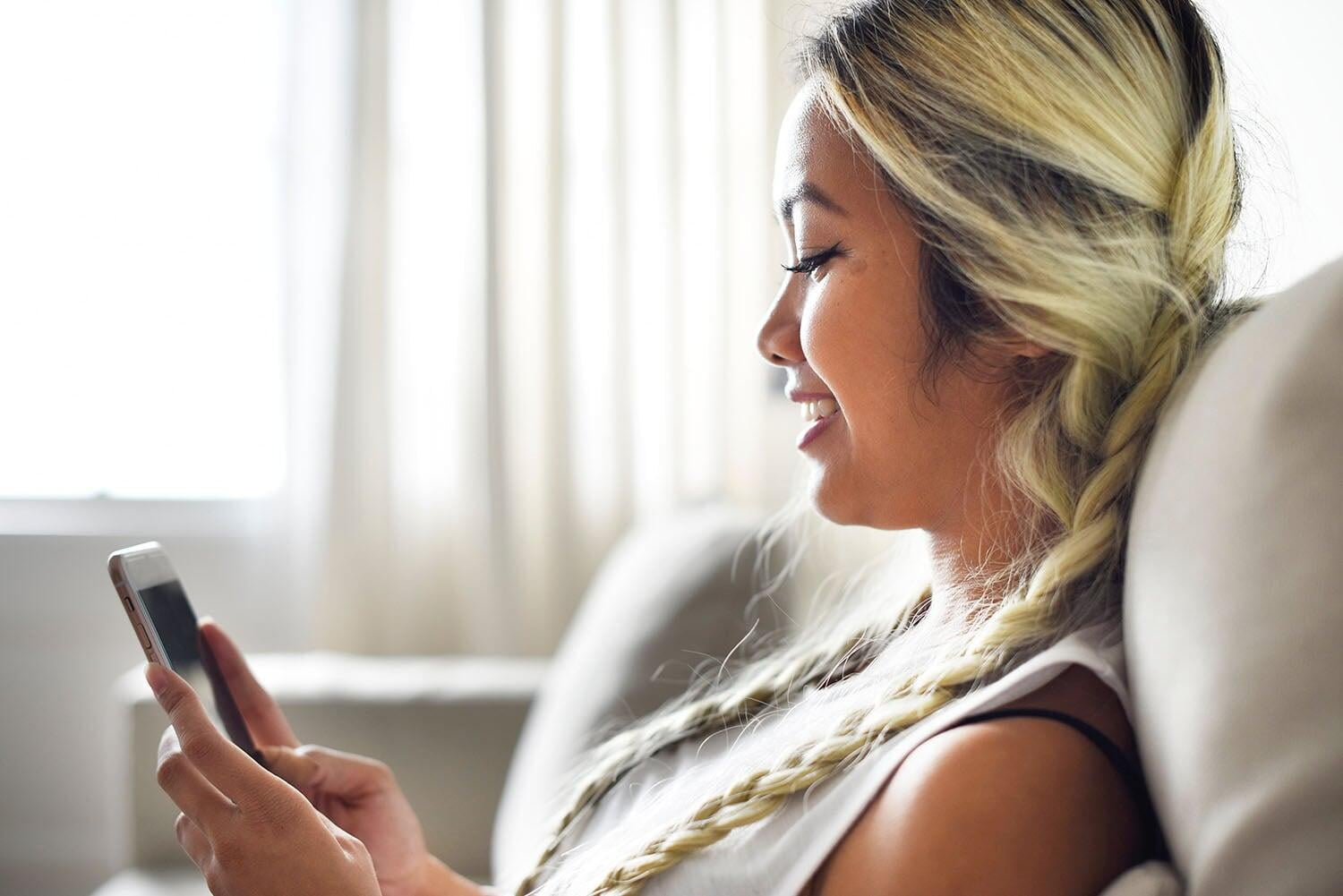 Woman-Looks-At-Phone